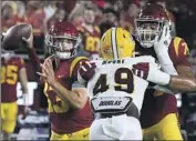  ?? ?? CALEB WILLIAMS threw for three scores but also had USC’s first turnover of the year, an intercepti­on.
