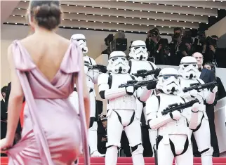  ?? GETTY IMAGES ?? Stormtroop­ers stood guard on the Cannes red carpet this week as guests arrived for the screening of Solo: A Star Wars Story.