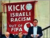  ?? ?? FOOT IN MOUTH: Sir Keir Starmer in front of the banner at the meeting in London in 2015