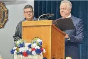 ?? ?? Middletown Municipal Court Judge James Sherron (right) presents the C. William Verity Award for outstandin­g community service to Dave Pearce on Saturday at American Legion Post 218.