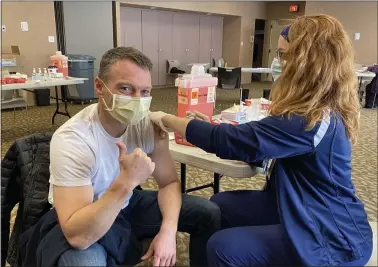  ?? PHOTO COURTESY ASHLEY JEFFERSON ?? Dr. Thomas Del Giorno, president of medical staff at Abington – Lansdale Hospital in Lansdale, gives a thumbs up as he receives some of the area’s first doses of the COVID-19vaccine in Montgomery County in December, 2020.