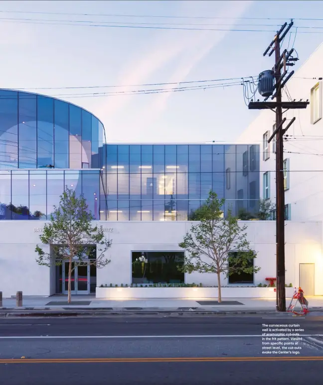  ??  ?? The curvaceous curtain wall is activated by a series of anamorphic cut-outs in the frit pattern. Viewed from specific points at street level, the cut-outs evoke the Center’s logo.