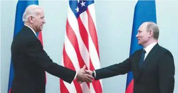  ??  ?? Putin shakes hands with Biden during their meeting in Moscow in 2011. – REUTERSPIX