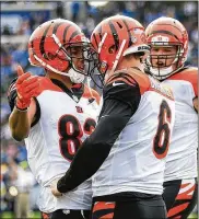 ?? SEAN M. HAFFEY / GETTY IMAGES ?? Bengals QB Jeff Driskel (6) celebrates a second-quarter TD run Sunday with Tyler Boyd. Upon review, the play was marked down inside the 1.