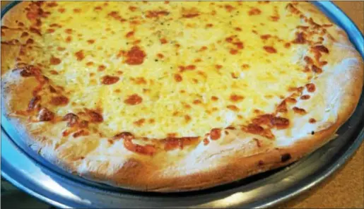  ?? PHOTO BY EMILY RYAN ?? According to a Harris Poll, pizza tops the list of Americans’ favorite comfort foods.