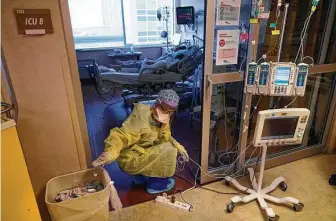  ?? Gerald Herbert / Associated Press ?? An ICU nurse moves electrical cords for medical machines on Aug. 17 outside the room of a COVID patient in an intensive care unit at the Willis-Knighton Medical Center in Shreveport, La.