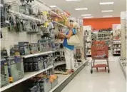  ?? JOE RAEDLE/GETTY ?? A customer shops Wednesday at a Target in Miami, Florida. The Minnesota-based retailer lost a quarter of its value following a weak earnings report.