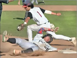  ?? Dan Watson/The Signal baserunner ?? Hart third baseman Casey Hinojosa (1) reaches as Golden Valley Jake Francero (20) slides safe in the fourth inning.