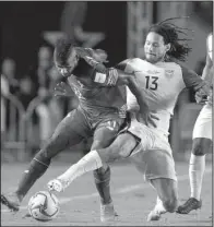  ?? AP/ARNULFO FRANCO ?? Panama’s Armando Cooper (left) fights for the ball with the United States’ Jermaine Jones during Tuesday night’s 2018 World Cup qualifying soccer match in Panama City. The U.S. moved into a tie for fourth place with Honduras in the North and Central...