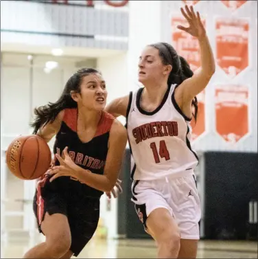  ?? JAMES BEAVER/FOR MEDIANEWS GROUP ?? Souderton’s Casey Harter (14) defends as Harriton’s Annie Aspesi (12) drives to the net.