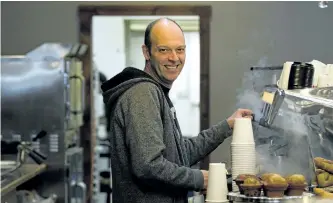  ?? JESSICA NYZNIK/EXAMINER ?? Steve Francis, owner of Natas Café, makes an Americano for a customer on Friday. Natas reopened Friday after a five-week closure due to water damage from a nearby fire.