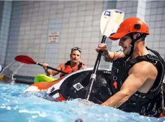  ?? Alexandra Wimley/Post-Gazette ?? Instructor Sebastian Foltz, right, gives a kayak class for 3 Rivers Outdoor Co. at Woodland Hills Intermedia­te School in Swissvale in February 2019. The company allows people to try out gear before buying.