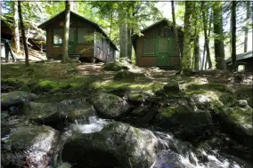  ?? ROBERT F. BUKATY-ASSOCIATED PRESS ?? In this photo dated Thursday, cabins awaits campers at the Camp Winnebago summer camp in Fayette, Maine.