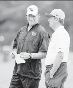  ?? MARK HUMPHREY / ASSOCIATED PRESS ?? Titans coach Ken Whisenhunt (left), talking with assistant Dick LeBeau, likes former Alabama fullback Jalston Flowers’ ability to catch passes.