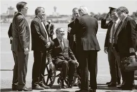  ?? Smiley N. Pool / Dallas Morning News file ?? Gov. Greg Abbott, shown during a June visit with President Trump, said the allegation­s against AG Ken Paxton, second from left, raise “serious concerns.”