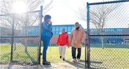 ?? LLOYD FOX/BALTIMORE SUN ?? Owen Keith picks up his girlfriend’s 7-year-old grandson, Justin Cook, at Harlem Park Elementary School. Keith wishes there were more activities for the city’s youth, which he thinks would help combat violence.