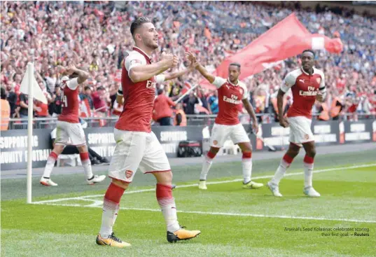  ?? — Reuters ?? Arsenal’s Sead Kolasinac celebrates scoring their first goal.