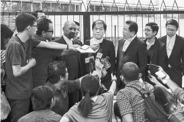  ??  ?? Lawyers representi­ng both accused hold a press conference after the trial at the Chemistry Department.