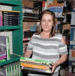  ??  ?? Aoife Fitzgerald of Readers Paradise with some school books.