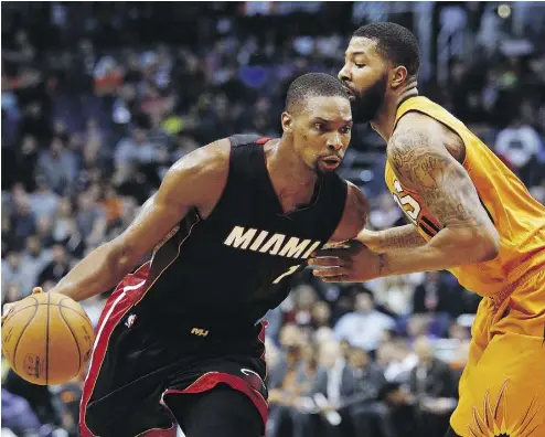  ?? RICK SCUTERI / THE ASSOCIATED PRESS FILES ?? Miami Heat forward Chris Bosh, left, is determined to continue his career despite recurring blood clot issues.