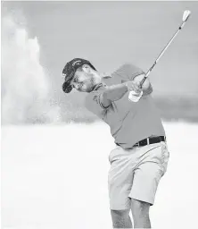  ?? Stuart Franklin / Getty Images ?? Xander Schauffele was one of the players who took advantage of wearing shorts during practice rounds on a steamy Monday.