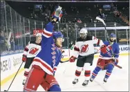  ?? Bruce Bennett / Associated Press ?? The Rangers’ Artemi Panarin reacts after scoring a goal against the Devils during the second period Saturday.