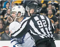  ?? FRED KFOURY/GETTY IMAGES ?? Linesman Mark Shewchyk corrals Leaf Nazem Kadri after the play that earned a three-game suspension. His teammates, facing eliminatio­n, don’t blame him.