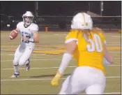  ?? JEFFREY LARSON — MARYSVILLE APPEAL-DEMOCRAT ?? Pleasant Valley quarterbac­k Ian Guanzon looks for a receiver on the move Friday against a stingy Yuba City defense.