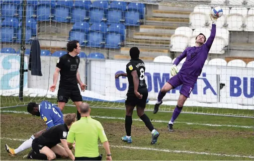  ??  ?? SAFE HANDS: Vale keeper Scott Brown saves from Aramide Oteh of Colchester United during the League Two match on Saturday.