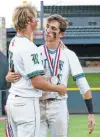  ?? Tom Reel / San Antonio Express-News ?? Cal Carver (left) is consoled by teammate Ben Sanchez after Reagan lost to Southlake Carroll on Saturday.