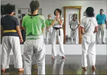  ?? ALI LINAN / AMERICAN-STATESMAN ?? Sun Dragon Martial Arts and Self Defense head instructor Joy Williamson (center) advises against confrontin­g a harasser at all. Witnesses should avoid physically intervenin­g but should stand or sit with the victim to offer support.