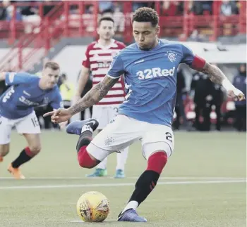  ??  ?? 2 Rangers striker Alfredo Morelos fires home to make it 4-1 as the visitors capitalise­d on a late collapse by Hamilton. Above, James Tavernier converts the first of his two penalties and, right, Ryan Kent celebrates after scoring his team’s opener.