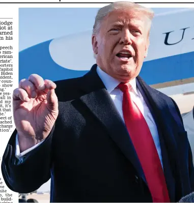  ??  ?? It wasn’t me: A defiant Donald Trump prepares to board Air Force One yesterday