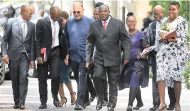  ?? PHANDO JIKELO African News Agency (ANA) ?? FINANCE Minister Tito Mboweni, centre, and his team from the National Treasury on their way to the National Assembly where the minister delivered his 2019 Medium-Term Budget Policy Statement last month. |
