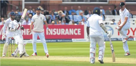  ??  ?? England captain Alastair Cook felt real pain after being struck in the knee at Lord’s yesterday