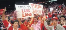  ?? GREG SORBER/JOURNAL FILE ?? Fans cheer during the nationally televised game between New Mexico and Arizona in the jam-packed Pit.