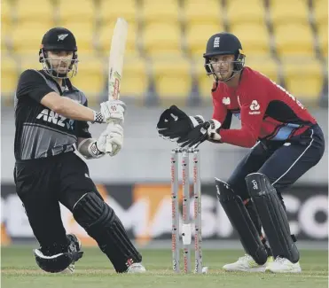  ??  ?? 0 Wicketkeep­er Jos Buttler looks on as New Zealand batsman Kane Williamson hits out on his way to 72.