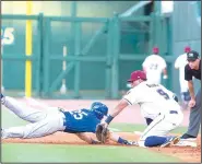  ?? Special to NWA Democrat-Gazette/DAVID BEACH ?? Tulsa’s Blake Gailen (left) is tagged out by Naturals first baseman Samir Duenez on a pick-off play Thursday.