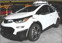  ?? Associated Press photo ?? In this file photo, a self-driving Chevrolet Bolt EV that is in General Motors Co.’s autonomous vehicle developmen­t program appears on display at GM’s Orion Assembly in Lake Orion, Mich.