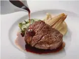  ??  ?? Savour The Lighthouse’s beef tenderloin with Barbaresco reduction, mashed potato and baby zucchini, as well as the Antipasti Seafood Trio, in a sleek setting with a view.