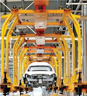  ?? Photo: Xinhua ?? Photo taken on July 6, 2019 shows a production line at a subsidiary of Beijing Electric Vehicle Co., Ltd. (BJEV), a new energy vehicle producer, in Huanghua city of Cangzhou, north China’s Hebei Province.
