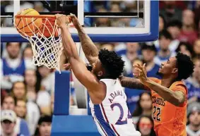  ?? Charlie Riedel/Associated Press ?? K.J. Adams Jr. scored 14 points, including the go-ahead basket with 5.8 seconds left, to help lead Kansas past Oklahoma State on Saturday in its Big 12 opener.