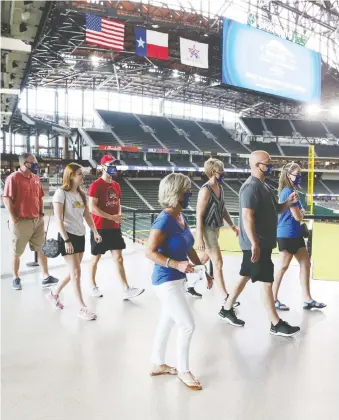  ?? TIM HEITMAN/USA TODAY SPORTS ?? Fans tour Globe Life Field, the shiny new home of the Texas Rangers built with at least US$500 million of taxpayers’ money, back on June 1.