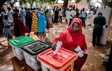  ??  ?? HOPE: A woman casts her vote at a polling station at the Malkohi refugee camp in Adamawa State in Nigeria. Malkohi is an internal displaced camp for people who fled their homes from areas affected by the conflict with the Islamist terrorist group Boko Haram