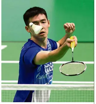  ??  ?? Close shave: Cheam June Wei had to dig deep into his reserves to beat Sri Lanka’s Niluka Karunaratn­e in the men’s singles qualifying match of the Asian Badminton Championsh­ips in China yesterday.