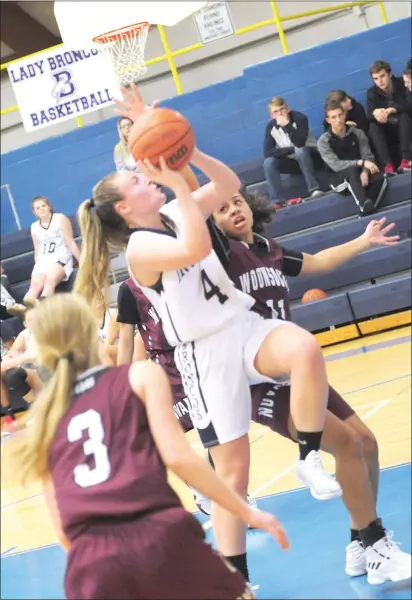  ?? Photo by Ernest A. Brown ?? Burrillvil­le guard Jamie Loynds (2) goes to the basket in the second half of her team’s 35-27 victory over visiting Woonsocket Tuesday night. Woonsocket’s Grace Washington (11) attempts to block the shot from behind.