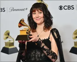  ?? FREDERIC J. BROWN — GETTY IMAGES ?? Singer Molly Tuttle of Santa Clara, who was raised in Palo Alto, holds her award for best bluegrass album for “Crooked Tree” during the 65th annual Grammy Awards at the Crypto.com Arena in Los Angeles on Sunday.