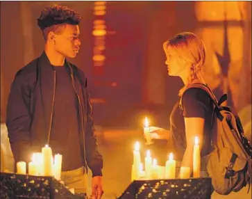  ?? Alfonso Bresciani Freeform ?? AFTER SAVING each other’s life as young children, Tyrone Johnson (Aubrey Joseph) and Tandy Bowen (Olivia Holt) reunite as teens, awakening hidden superpower­s in Freeform series “Marvel’s Cloak & Dagger.”