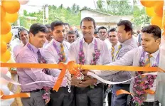  ??  ?? Union Assurance management along with the branch staff at the relocation of Ambalantot­a regional office