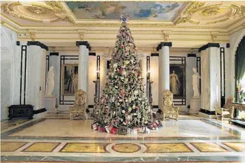  ?? FILE PHOTO ?? A 16-foot Christmas tree glitters in the Grand Hall of Whitehall at Henry Morrison Flagler Museum in Palm Beach. Stranahan House offers a Victorian-themed tour.